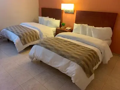 Cama o camas de una habitación en Casagrande Hotel