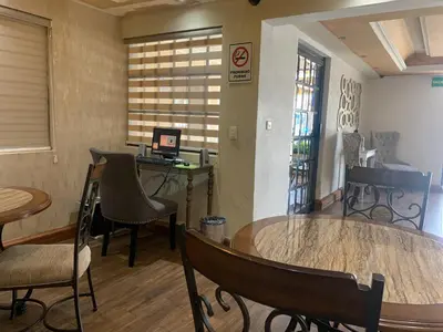 Una televisión o centro de entretenimiento en Casagrande Hotel