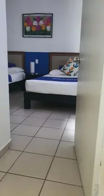 Cama o camas de una habitación en La Estancia Apartments Mazatlan