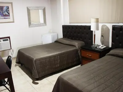 Cama o camas de una habitación en Hotel America Palacio