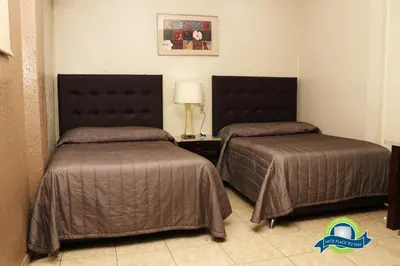Cama o camas de una habitación en Hotel America Palacio