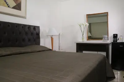 Cama o camas de una habitación en Hotel America Palacio