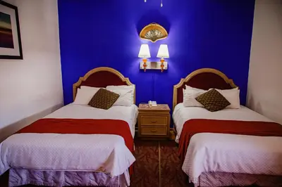 Cama o camas de una habitación en HOTEL BOUTIQUE EL VIEJO MUNDO