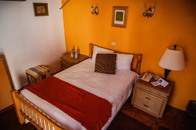 Cama o camas de una habitación en HOTEL BOUTIQUE EL VIEJO MUNDO