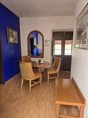Una televisión o centro de entretenimiento en HOTEL BOUTIQUE EL VIEJO MUNDO