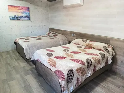 Cama o camas de una habitación en HOTEL BAEZA
