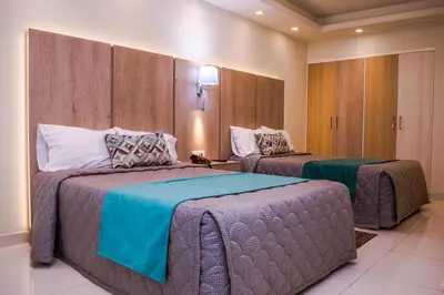 Cama o camas de una habitación en La Siesta Hotel