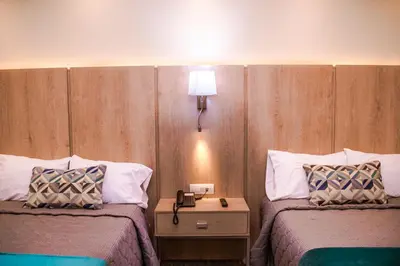 Cama o camas de una habitación en La Siesta Hotel