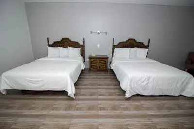 Cama o camas de una habitación en Hotel Posada Tierra Blanca