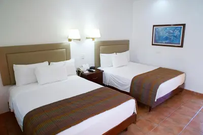 Cama o camas de una habitación en Best Western Saltillo