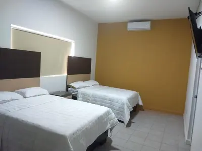 Cama o camas de una habitación en Hotel del Bosque