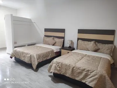 Cama o camas de una habitación en Hotel del Bosque