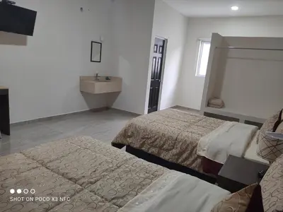 Cama o camas de una habitación en Hotel del Bosque