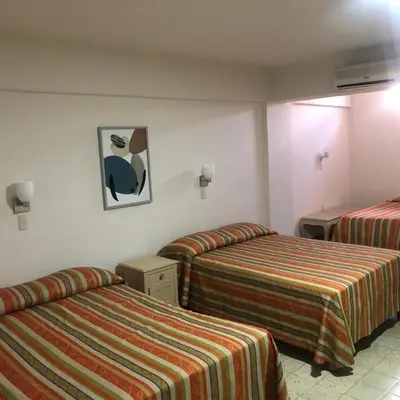 Cama o camas de una habitación en Hotel Lorena