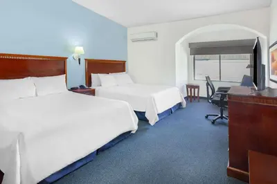 Cama o camas de una habitación en Days Inn by Wyndham Piedras Negras