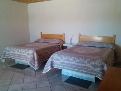 Cama o camas de una habitación en Cabañas Los Portales Barrancas del Cobre