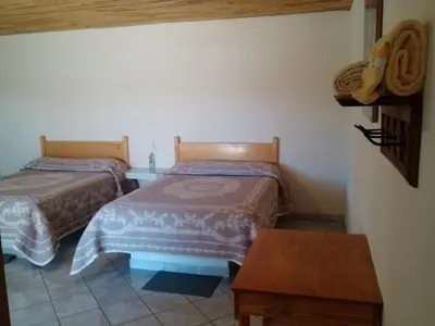Cama o camas de una habitación en Cabañas Los Portales Barrancas del Cobre