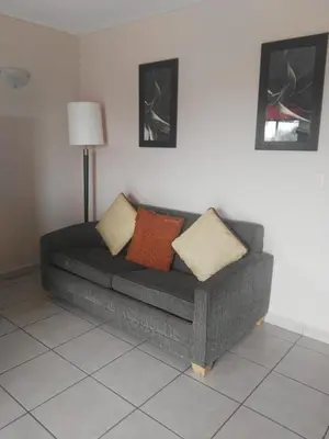 Zona de estar de Los Jitos Hotel & Suites