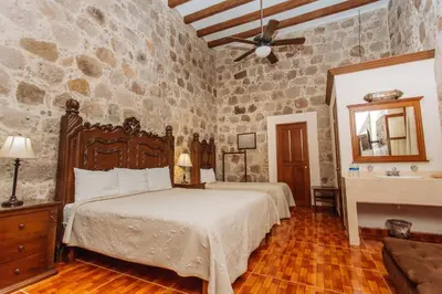 Cama o camas de una habitación en Mansion Serrano Hotel