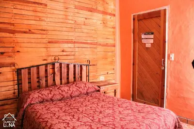 Cama o camas de una habitación en Cabañas Claro de Luna