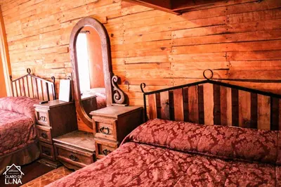 Cama o camas de una habitación en Cabañas Claro de Luna