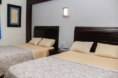 Cama o camas de una habitación en Maxihotel Business Class Culiacan