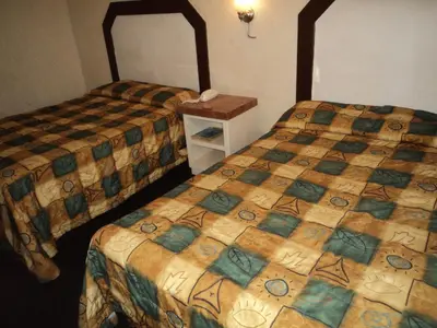 Cama o camas de una habitación en Hotel San Luis de Nogales