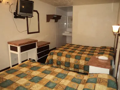 Cama o camas de una habitación en Hotel San Luis de Nogales