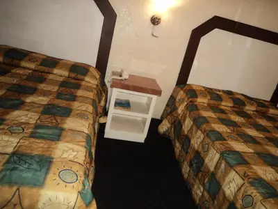 Cama o camas de una habitación en Hotel San Luis de Nogales