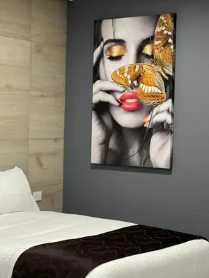 Cama o camas de una habitación en Madison Suites