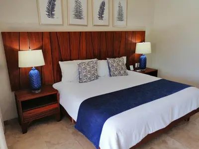 Cama o camas de una habitación en Luxury Suites By Estrella del Mar
