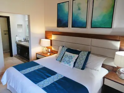 Cama o camas de una habitación en Luxury Suites By Estrella del Mar
