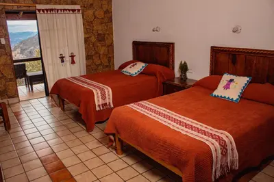 Cama o camas de una habitación en Hotel Divisadero Barrancas