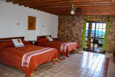 Cama o camas de una habitación en Hotel Divisadero Barrancas