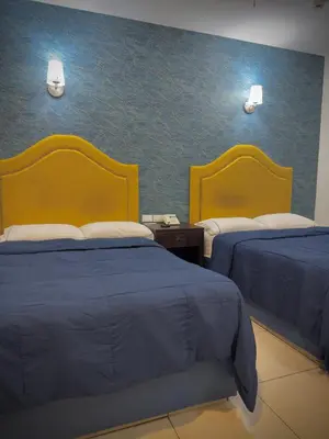 Cama o camas de una habitación en Hotel Maioris Kumate Culiacán