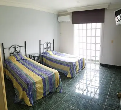 Cama o camas de una habitación en Hotel Playa María