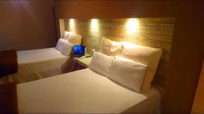 Cama o camas de una habitación en Hotel Royal Inn