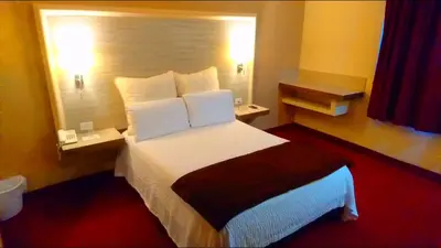 Cama o camas de una habitación en Hotel Royal Inn