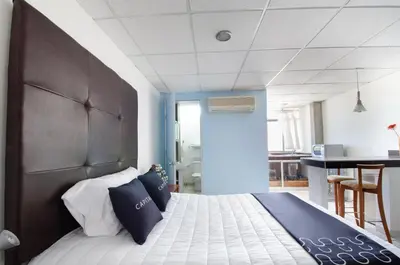 Cama o camas de una habitación en My Suite Ejecutiva