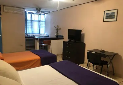 Cama o camas de una habitación en My Suite Ejecutiva