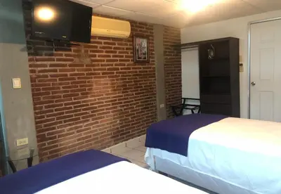 Cama o camas de una habitación en My Suite Ejecutiva