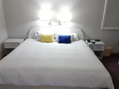 Cama o camas de una habitación en Paraíso Express
