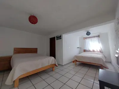 Cama o camas de una habitación en Casa Nopal Tu casa vacacional tipo hotel