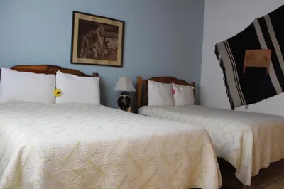 Cama o camas de una habitación en Hotel Paraiso del Oso