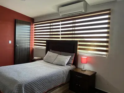 Cama o camas de una habitación en Departamentos Bonsai