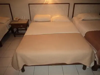 Cama o camas de una habitación en Hotel Kuraica