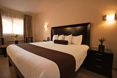 Cama o camas de una habitación en Hotel Del Rio