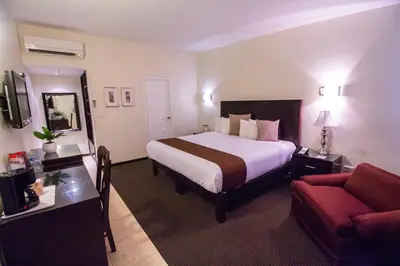 Cama o camas de una habitación en Hotel Del Rio