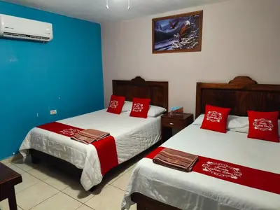 Cama o camas de una habitación en Hotel Posada Santa Elena