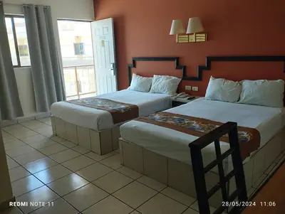 Cama o camas de una habitación en Hotel Hacienda Nainari